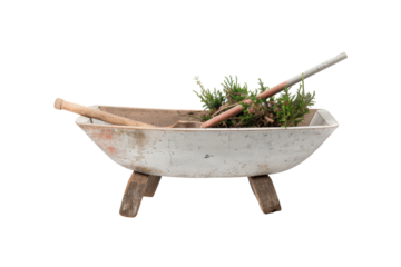 Rustic wooden wheelbarrow filled with garden tools and plants, isolated on white background. Perfect for gardening or vintage-themed designs.