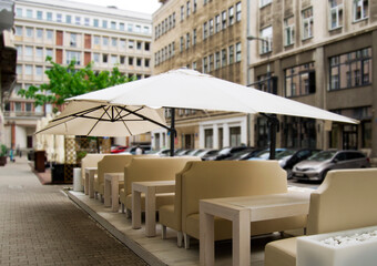 Luxury terrace with white chairs . Outdoor restaurant furniture