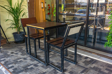 chairs and tables in front of the shop