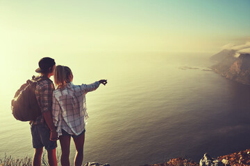 Fototapeta premium Hiking, view and pointing with couple in mountains for health, exercise or sightseeing together in summer. Peru, nature and travel with man, woman and holding hands on summit trail for mockup