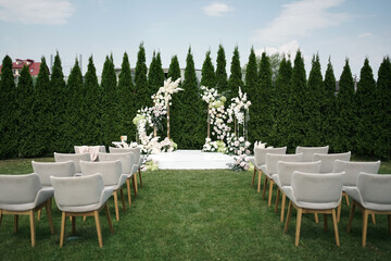 Flower arch on the lawn for the wedding ceremony.