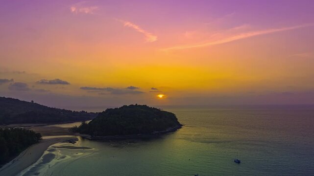 aerial hyperlapse view colorful sky of sunset above Kala island at Layan beach Phuket.
video 4K. Nature video High quality footage. 
Scene of Colorful romantic sky in sunset with cloud in the sky