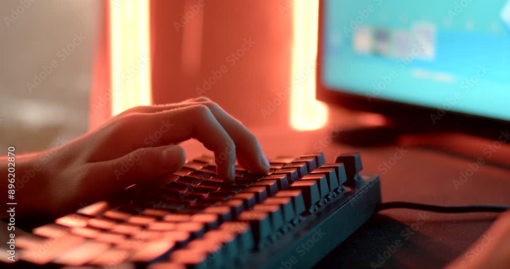 Poster a closeup perspective captures a hand typing on a mechanical keyboard with red backlighting in the b