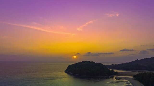 aerial hyperlapse view colorful sky of sunset above Kala island at Layan beach Phuket.
video 4K. Nature video High quality footage. 
Scene of Colorful romantic sky in sunset with cloud in the 