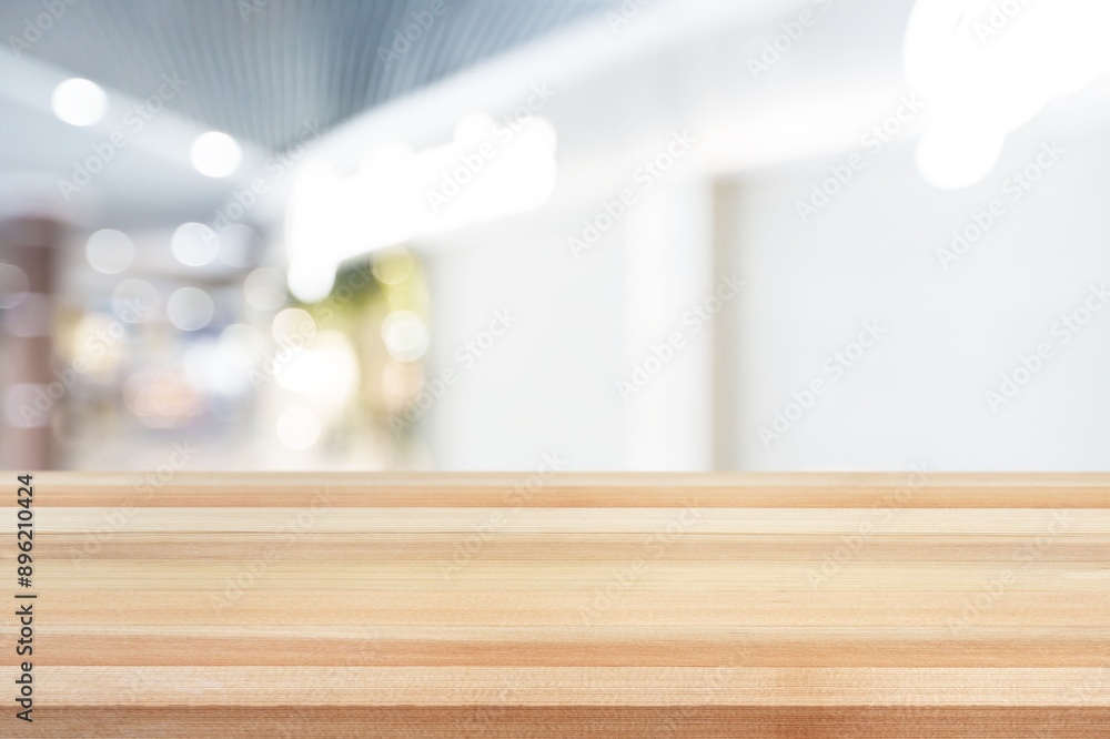 Wall mural empty wooden table on blurred abstract background