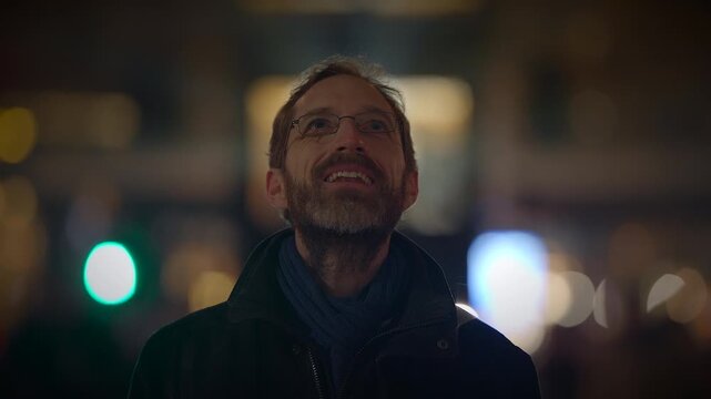 A man standing alone, looking up at the night sky, lost in contemplation and mystery