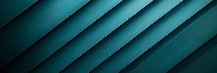 Obraz premium A close-up of a teal backdrop with diagonal lines that create a gentle gradient from dark to light shades