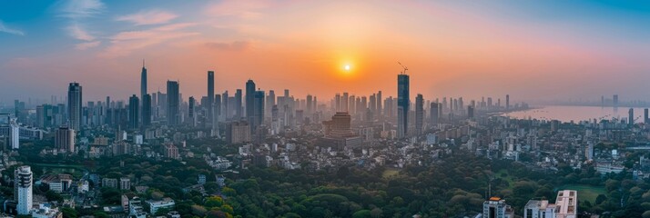 Obraz premium A panoramic view of Mumbai's skyline at sunset, showcasing the contrast between the dense urban development and the surrounding green areas, highlighting the urban heat island effect