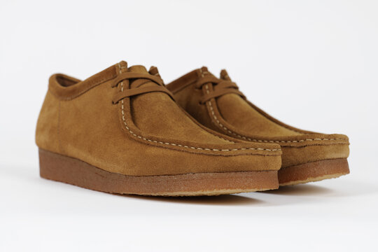 Copenhagen, Denmark - July 24, 2024: Clarks Wallabee product shot isolated on light grey background. Illustrative editorial photo.
