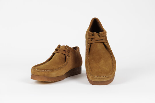 Copenhagen, Denmark - July 24, 2024: Clarks Wallabee product shot isolated on light grey background. Illustrative editorial photo.