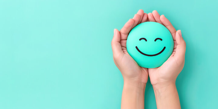 A smiley face in the hands of a girl