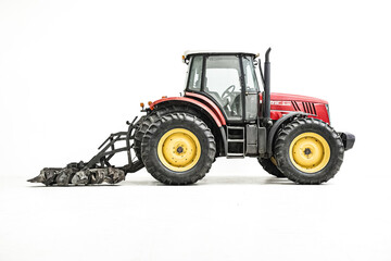 Obraz premium Red Tractor with Front Loader Isolated on White Background