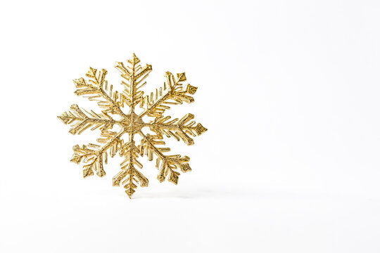 Gold Snowflake on White Background