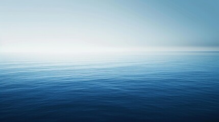 Obraz premium Gradient background transitioning smoothly from deep blue to pure white, evoking a sense of tranquility