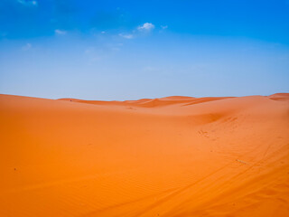 Sand dunes in the Sahara desert with blue sky in background, Merzouga, Morocco, North Africa