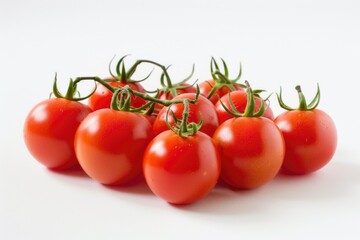 A bunch of red tomatoes are sitting on a white background