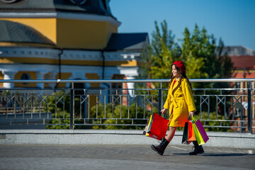 teen fashion girl after shopping in fall. autumn shopping sale. teenage girl go shopping in autumn coat. shopping sale and discount. girl shopper walking in autumn city. best sale offer. copy space