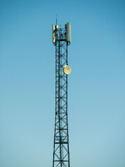 Cell tower, modern communication technology and infrastructure, vertical image 