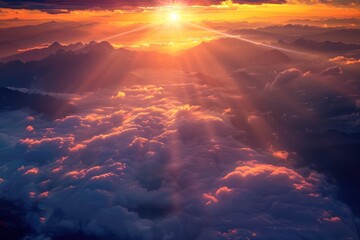 Obraz premium Aerial View of Sunset over Mountains and Clouds