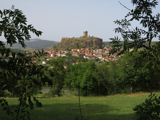 Beautiful green landscape with the view of the village of Polignac and the castle in the rear. Auvergne. France.