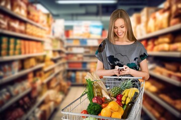 Young happy woman customer use mobile phone