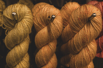 Several skeins of colored yarn. Fluffy plush yarn in cozy colors. Crocheting and knitting. A calm...