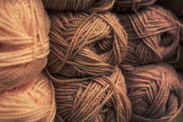 Several skeins of colored yarn. Fluffy plush yarn in cozy colors. Crocheting and knitting. A calm...