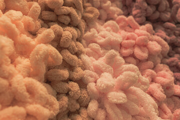 Several skeins of colored yarn. Fluffy plush yarn in cozy colors. Crocheting and knitting. A calm...