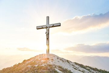 Cross on a Hilltop at Sunset
