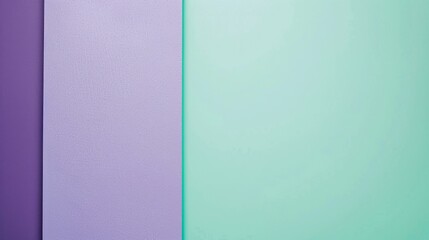 Fototapeta premium Minimalist image featuring a vibrant green surface next to a purple one, creating a visually appealing contrast. The pastel colors evoke a sense of calmness and tranquility