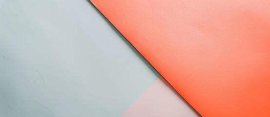 Minimalist composition featuring a modern design of three triangles in coral pink, light blue and white, creating an abstract background with copy space