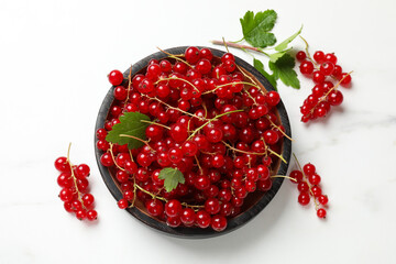Fresh red currant berries on white table, top view
