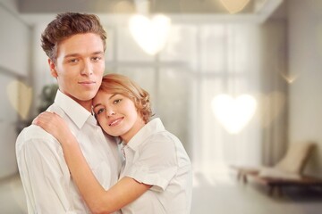 Fototapeta premium Valentine's Day concept. Young couple hugging at home.