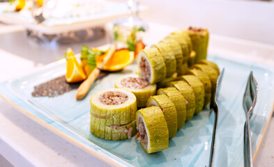 Stewed zucchini stuffed with meat and rice.