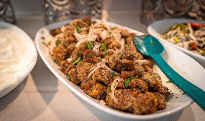 Stewed liver with herbs and onions.