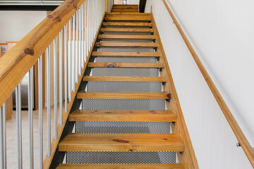 Staircase Made Of Wood With Steel Handrails And Contemporary Interior Design