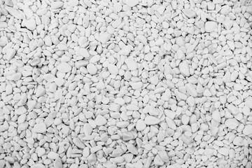Close-up for oval pebbles of white gravel stones. White gravel as a decorative and architectural ingredient. Black and White picture