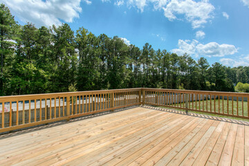 Spacious Outdoor Deck With Wooden Flooring And Beautiful Lush Forest View