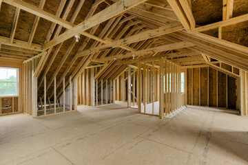 Spacious Unfinished Attic With Wooden Frame Construction And Ample Natural Light