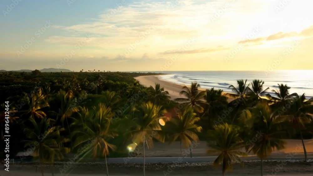 Poster a beach with palm trees and a beautiful sunset in the background. the sky is filled with clouds, cre