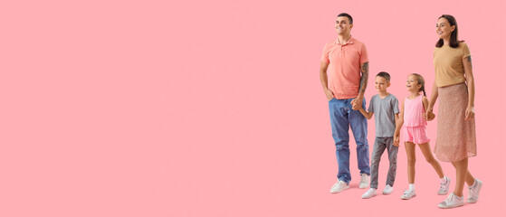 Fototapeta premium Happy family walking on pink background