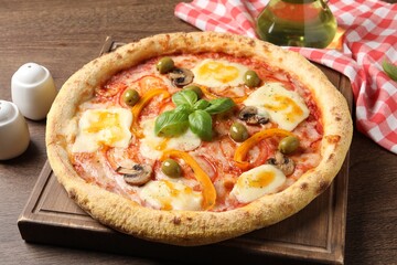 Delicious vegetarian pizza on wooden table, closeup