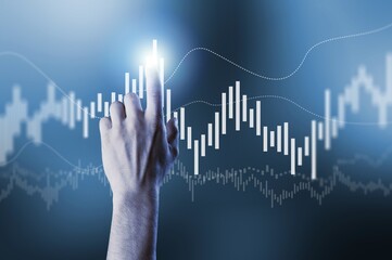 Investing and stock concept. Hand and data charts