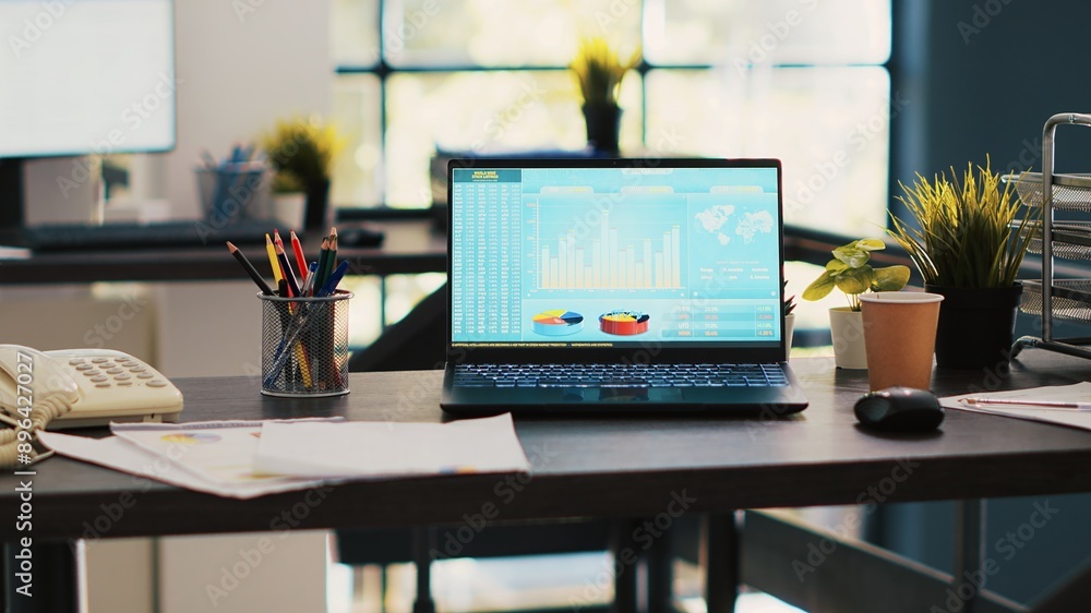 Poster stock market diagrams with charts and stock figures on laptop showing profits, empty workspace. trad