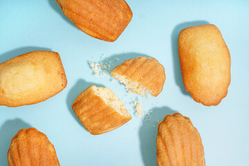 Tasty madeleines on blue background