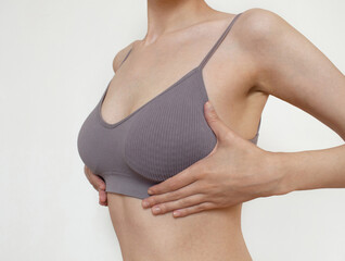close up of female breast. Woman breast or natural tits in lingerie. Plastic surgery. breast lift...