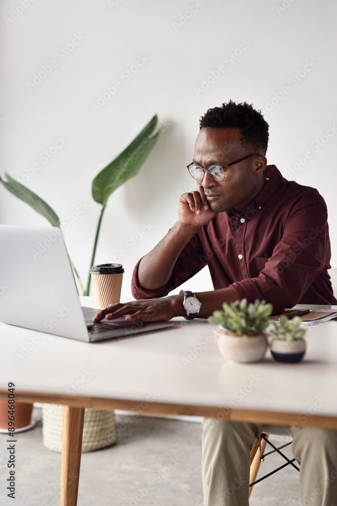 Poster Idea, black man and laptop in office for research, email and connection for networking. Business, technology and website developer at desk for career, project and thinking or creativity for proposal