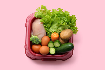 Bowl with healthy pet food on pink background