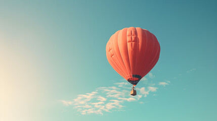 Fototapeta premium A hot air balloon in flight on a sky blue background.