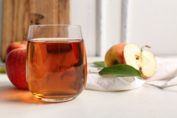 Glass of fresh apple juice on white background